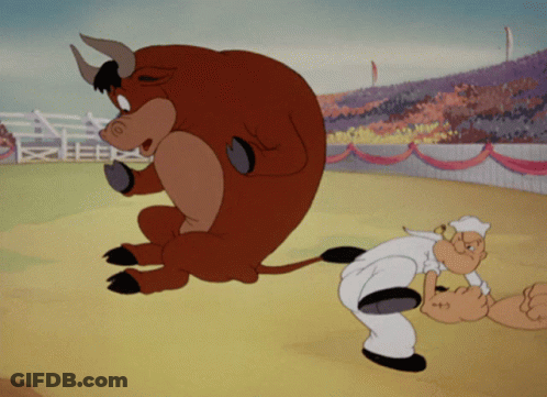 A Cartoon Of A Man And A Bull In A Stadium GIF