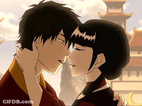 A Cartoon Of A Man And A Woman Kissing In Front Of A Building GIF