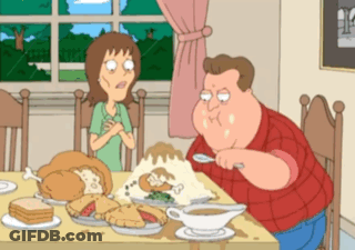A Cartoon Of A Man And A Woman Sitting At A Table With Food On It GIF