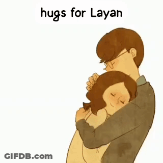 A Cartoon Of A Man And Woman Hugging Each Other With The Words `` Hugs For Layan '' Written Above Them . GIF