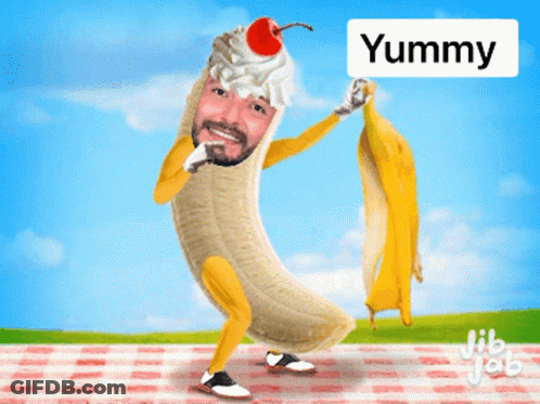 A Cartoon Of A Man Dressed As A Banana With A Cherry On Top And The Word Yummy Above Him GIF