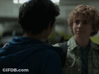 A Cartoon Of A Man Holding Another Man 'S Arm And A Man With A Big Face . GIF