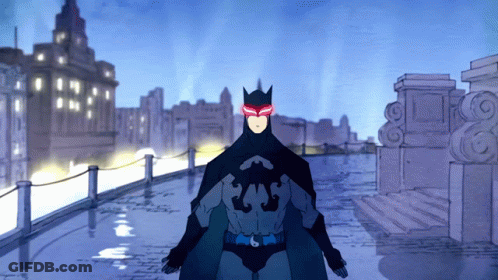 A Cartoon Of A Man In A Batman Costume With Red Eyes GIF