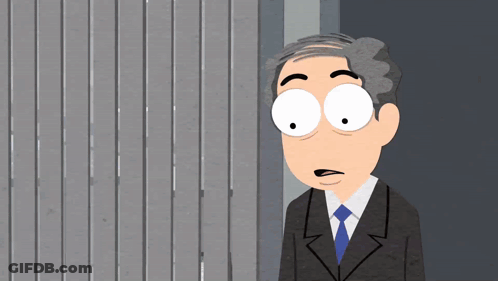 A Cartoon Of A Man In A Suit And Tie Standing In Front Of A Wall GIF