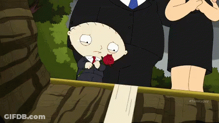 A Cartoon Of A Man In A Suit And Tie Standing Next To A Woman Holding A Rose GIF