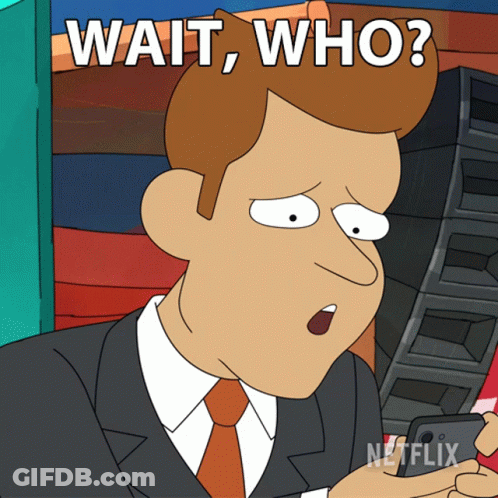 A Cartoon Of A Man In A Suit And Tie With The Words Wait Who GIF