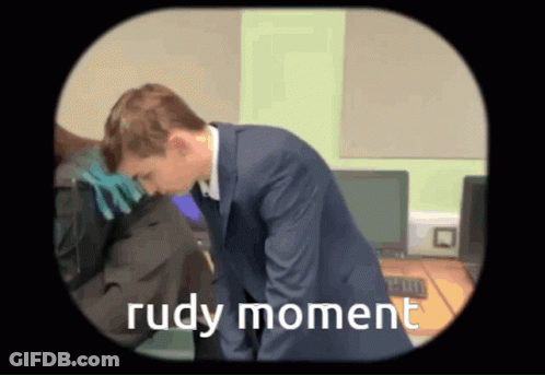 A Cartoon Of A Man In A Suit With The Words Rudy Moment On The Bottom GIF