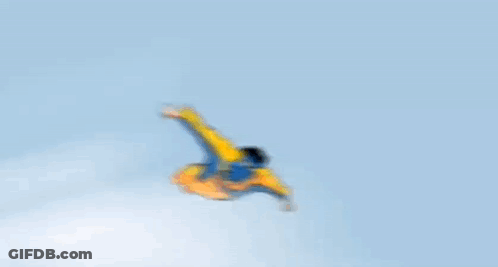 A Cartoon Of A Man In A Yellow And Blue Superhero Costume Flying Through The Air GIF