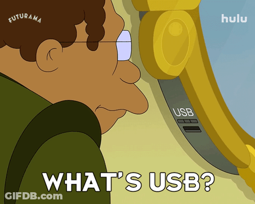 A Cartoon Of A Man Looking At A Usb Port And The Words What 'S Usb GIF