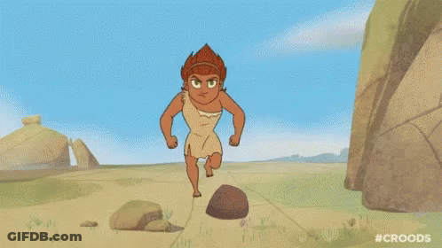A Cartoon Of A Man Running On A Dirt Road Next To Rocks . GIF