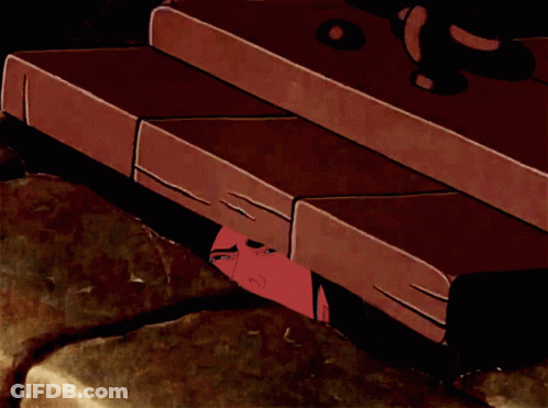 A Cartoon Of A Man 'S Head Sticking Out Of A Hole In A Wall GIF