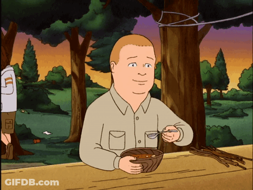 A Cartoon Of A Man Sitting At A Table Eating A Bowl Of Food GIF