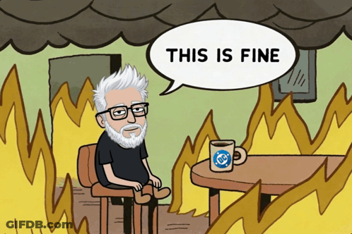 A Cartoon Of A Man Sitting At A Table With A Speech Bubble Saying " This Is Fine " GIF