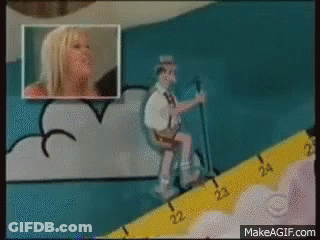 A Cartoon Of A Man Sitting On A Toilet Next To A Ruler That Says Makeagif.com On It GIF