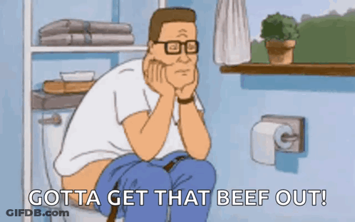A Cartoon Of A Man Sitting On A Toilet Saying Gotta Get That Beef Out . GIF