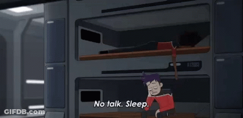 A Cartoon Of A Man Talking On A Cell Phone While A Woman Sleeps On Bunk Beds . GIF