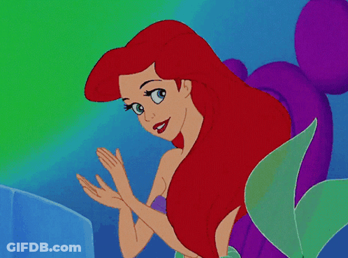 A Cartoon Of A Mermaid With Red Hair And Blue Eyes GIF