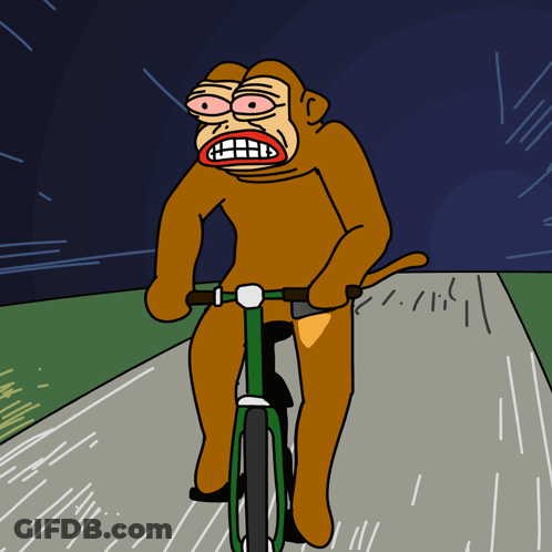 A Cartoon Of A Monkey Riding A Bike GIF