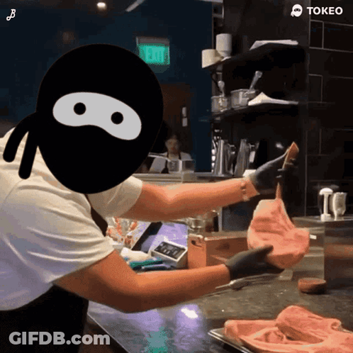 A Cartoon Of A Ninja Holding A Piece Of Meat With The Word Tokeo On The Bottom GIF