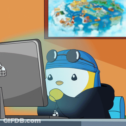 A Cartoon Of A Penguin Sitting In Front Of A Computer Monitor GIF