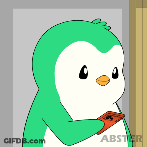 A Cartoon Of A Penguin Talking On A Cell Phone GIF