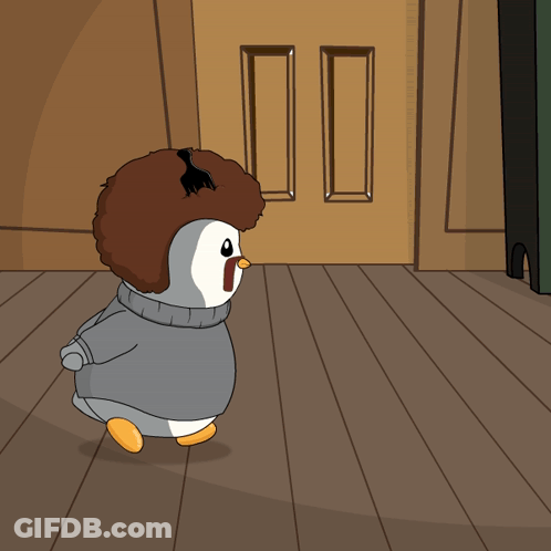 A Cartoon Of A Penguin Wearing A Sweater With The Letter N On Its Face GIF