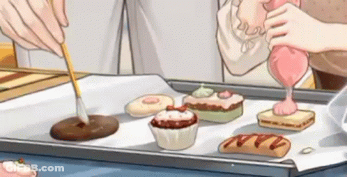 A Cartoon Of A Person Decorating Cupcakes On A Tray . GIF