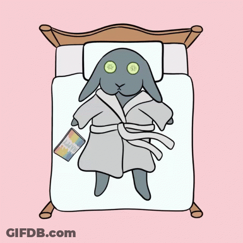 A Cartoon Of A Rabbit In A Bathrobe Laying On A Bed GIF