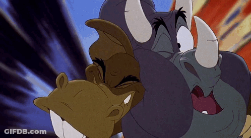 A Cartoon Of A Rhino And A Horse With Horns Looking At Each Other GIF