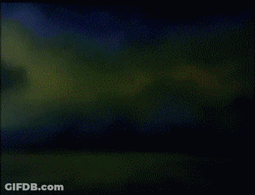 A Cartoon Of A Robot With A Red Light On It GIF
