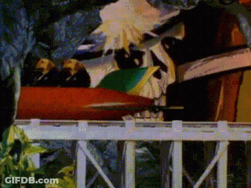 A Cartoon Of A Roller Coaster With A Skull On It GIF