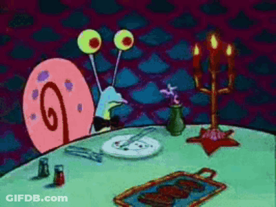 A Cartoon Of A Snail Sitting At A Table With A Plate Of Food On It GIF