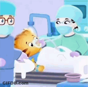 A Cartoon Of A Teddy Bear Being Operated On By A Group Of Doctors GIF