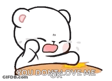 A Cartoon Of A Teddy Bear Crying While Sitting On A Table . GIF
