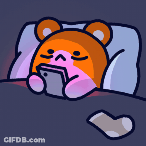 A Cartoon Of A Teddy Bear Laying In Bed With A Cell Phone GIF