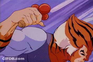 A Cartoon Of A Tiger Holding A Red Object In His Hand GIF