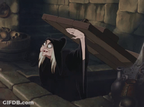 A Cartoon Of A Witch Holding A Wooden Plank GIF