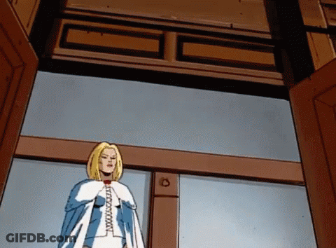 A Cartoon Of A Woman In A Blue And White Cape With The Letter C On Her Chest GIF