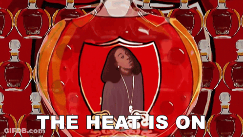 A Cartoon Of A Woman In A Shield With The Words The Heat Is On Below Her GIF