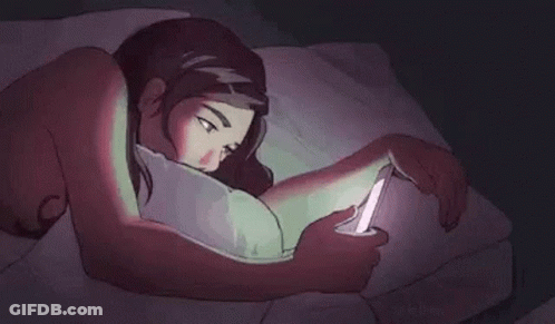 A Cartoon Of A Woman Laying In Bed Looking At Her Phone . GIF