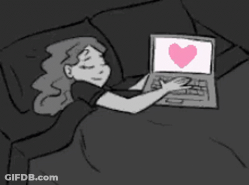 A Cartoon Of A Woman Laying In Bed Using A Laptop With A Heart On The Screen GIF
