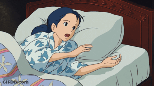 Woman Lying In Bed With Mouth Open GIF