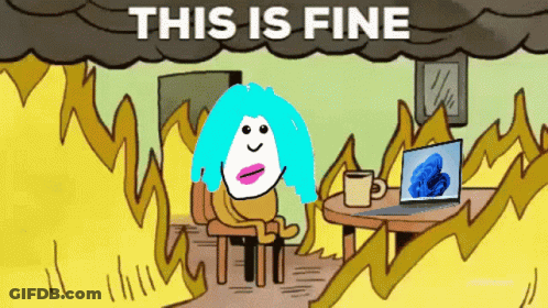 A Cartoon Of A Woman Sitting At A Table With A Laptop And A Cup Of Coffee Under A Cloud That Says This Is Fine GIF