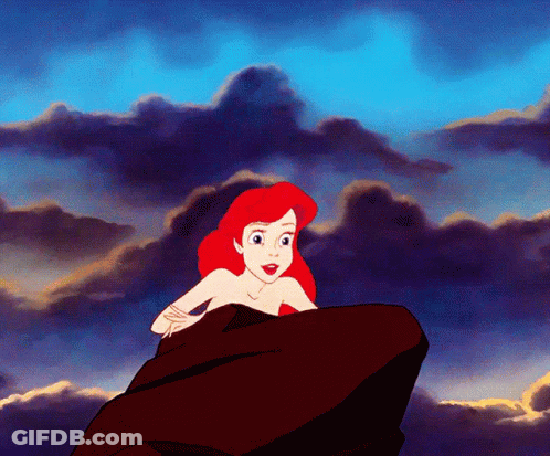 A Cartoon Of A Woman Sitting On A Rock GIF