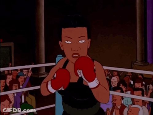A Cartoon Of A Woman Wearing Boxing Gloves GIF