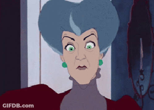 A Cartoon Of A Woman With Blue Hair And Green Earrings GIF
