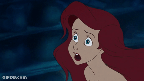 A Cartoon Of A Woman With Red Hair And Blue Eyes GIF