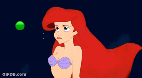 A Cartoon Of Ariel From The Little Mermaid Is Looking At A Green Ball . GIF