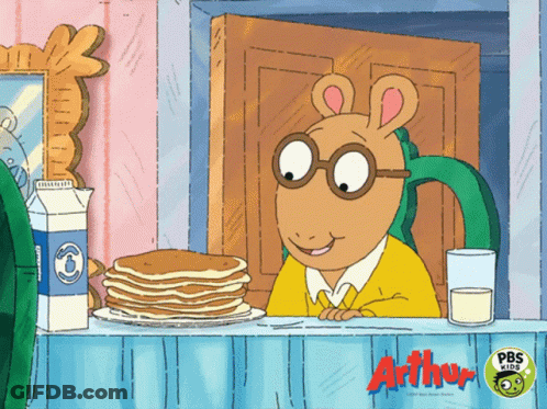A Cartoon Of Arthur Sitting At A Table With Pancakes And Milk From Pbs Kids GIF