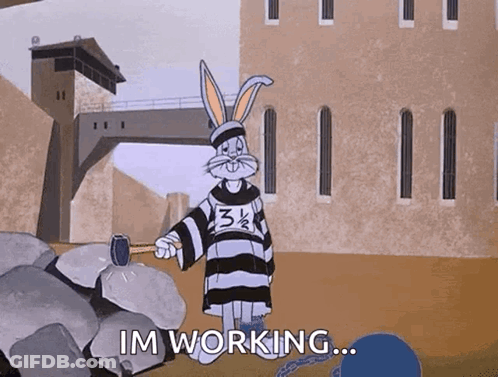 A Cartoon Of Bugs Bunny Holding A Hammer And Saying Im Working GIF